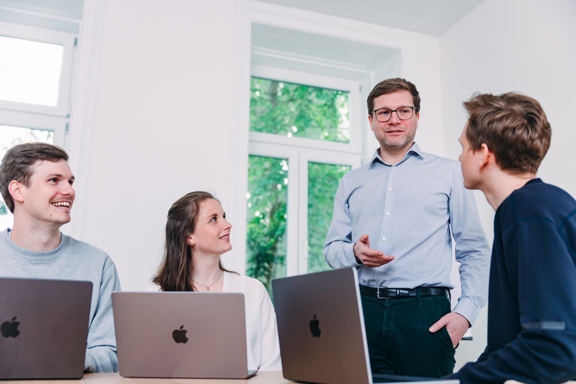 Four people talking to each other
